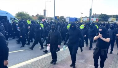 Masked protesters hold 'anti-illegal migrant' demo in UK
