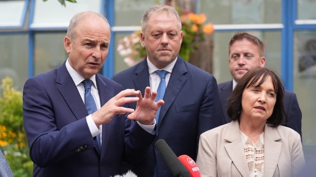 Taoiseach and Fianna Fail leader Micheal Martin (left) speaking to the media during Fianna Fail's annual think-in