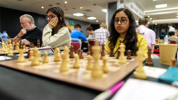 Trisha Kanyamarala at a chess board