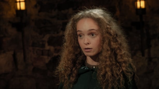 Aoife puts on the cloak