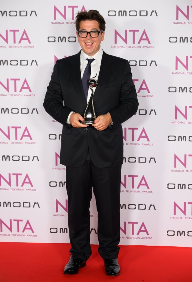 TV presenter on red carpet of NTAs with award