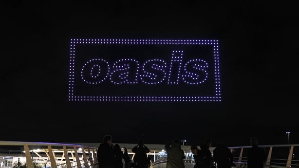 A drone light show over the Joie Stadium football ground at the Etihad Campus in Manchester, revealing the time and date of the forthcoming Oasis tour announcement.