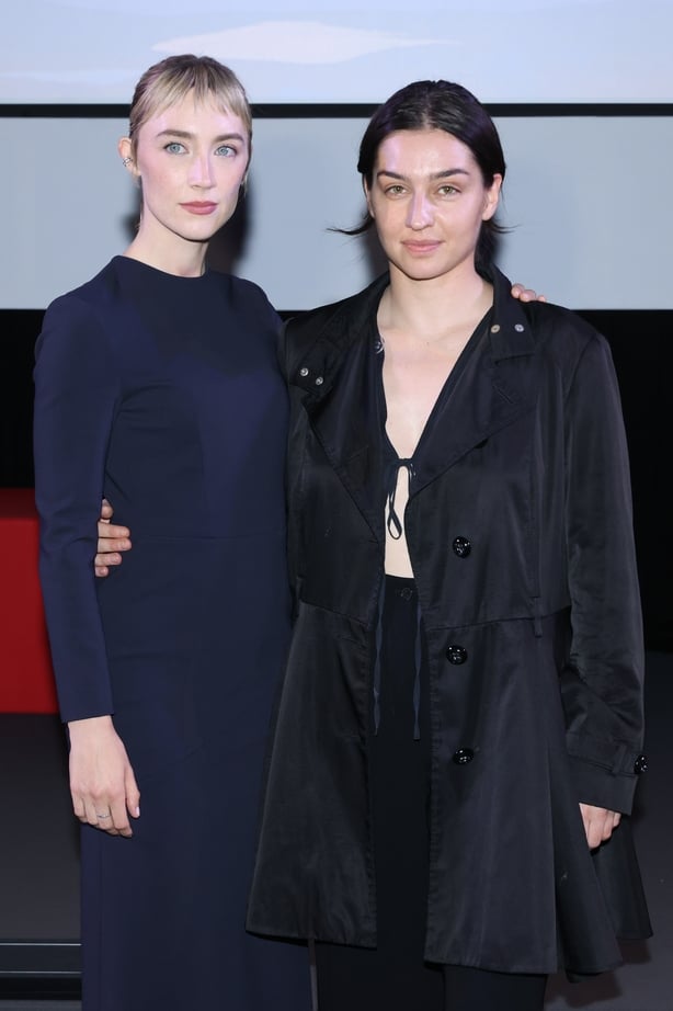 VENICE, ITALY - SEPTEMBER 10: Saoirse Ronan (L) and a guest attends the