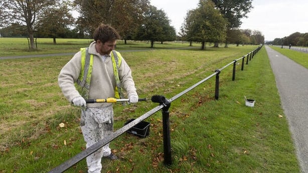 Painter Carl working on behalf of the OPW, painting the railings in the Phoenix Park