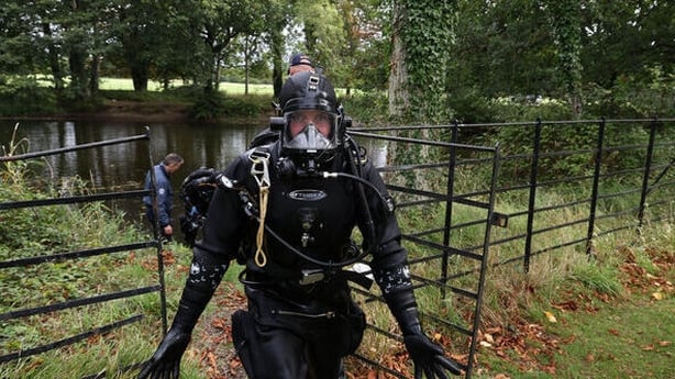 Members of the Garda water Unit check ponds and waterways in the vicinity of Aras an Uachtarain and Farmleigh House