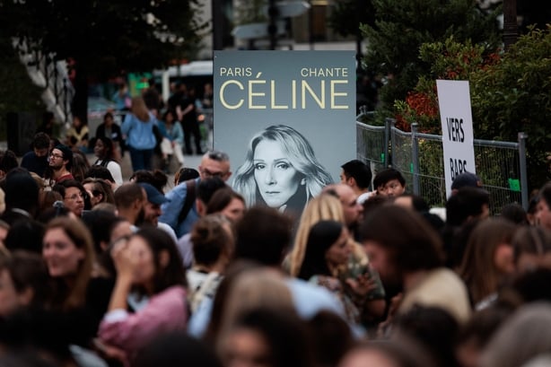 Fans take part in a massive karaoke event dedicated to Celine Dion at Place de la Bataille-de-Stalingrad in Paris, on 11 September, 2026. (Photo by Gauthier Bedrignans/Hans Lucas via AFP)