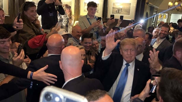 US President Donald Trump walks through the members bar of his Doonbeg golf resort