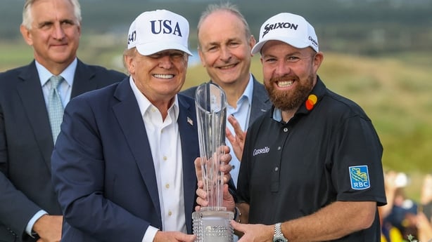 Ireland's Shane Lowry (R) poses with US President Donald Trump (L) during the trophy presentation following his victory on the final day of the Irish Open golf tournament at the Trump International Golf Links & Hotel, a resort and golf course owned by the president, in Doonbeg, western Ireland on Se
