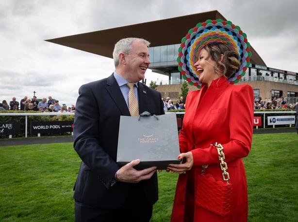 Ciaran Reidy General manager of The Grace, Westport Estate presents style winner Laura Hanlon with her prize