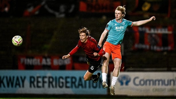 Sean Mullen of Bohemians is challenged by Drogheda United's Ryan Markey
