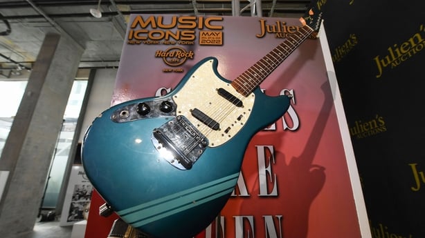 The blue 1969 Mustang Fender guitar used by rock icon Kurt Cobain in the 1991 Nirvana music video "Smells Like Teen Spirit" is displayed at the media preview of the "Music Icons" auction, at Julien's Auctions in Beverly Hills, California, on April 11, 2022. - The guitar is expected to fetch up to US