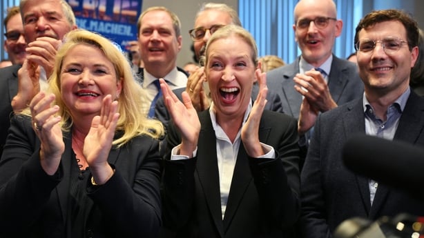 Co-leader of the far-right Alternative for Germany (AfD) party Alice Weidel (C) and AfD top candidate for Berlin Kristin Brinker (L) celebrate after the announcement of the first exit poll results for Mecklenburg-Western Pomerania on public television at the electoral evening event of the Germany's 