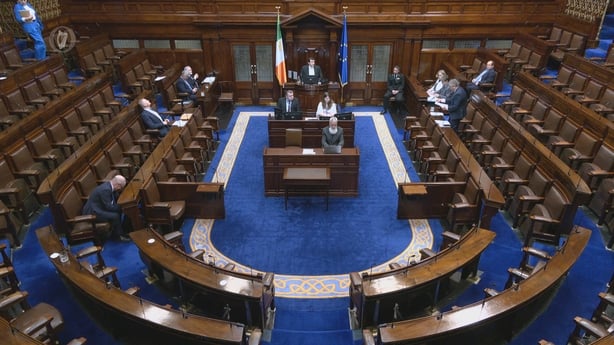 a view of the dail chamber with a few TDs present