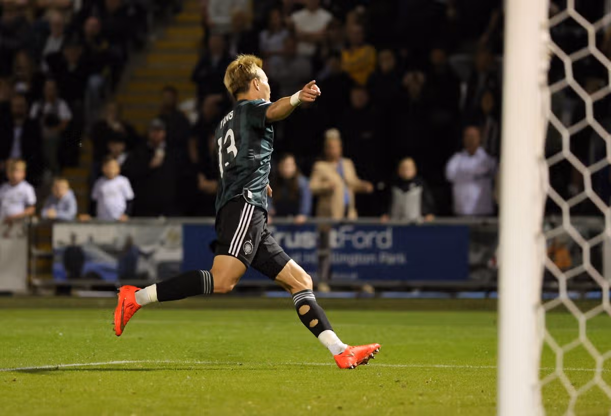 Yang celebrates his goal for Celtic