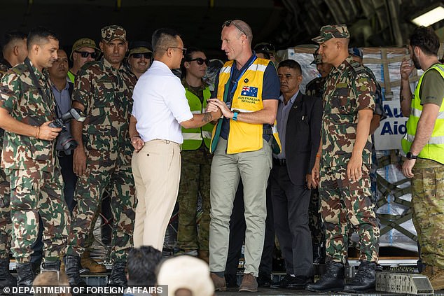 Australian ambassador to Nepal, Simon Ernst, and Nepal's Minister for Home Affairs. Sudan Gurung, onboard A Royal Australian Air Force C-17A Globemaster III at Tribhuvan International Airport in Kathmandu