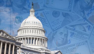 A photo of the US Capitol building with $100 bills overlaying the blue sky.
