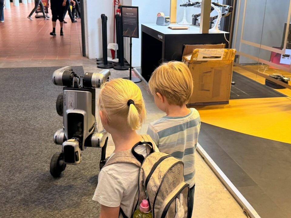 Children watch robots dancing at the IFA 2026 in Berlin on Sept. 4.