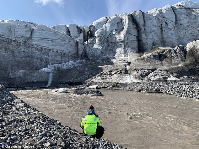 Melting Arctic glaciers are creating a 'doom loop' by flushing methane out into rivers. Pictured: A glacial river on Svalbard