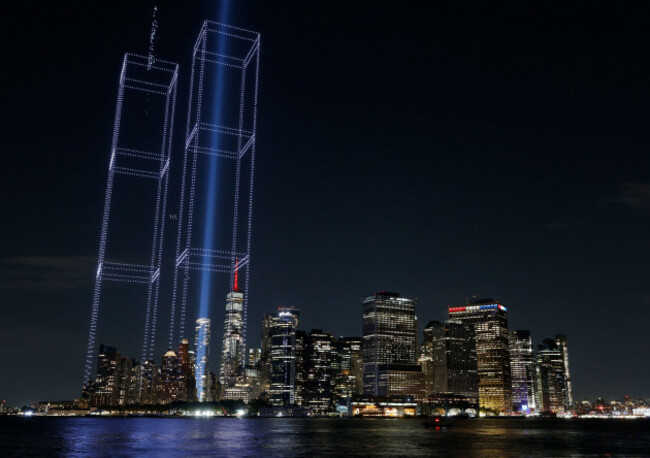 a-light-installation-in-the-shape-of-the-twin-towers-is-illuminated-with-drones-over-one-world-trade-center-and-the-manhattan-skyline-in-the-days-leading-up-to-the-25th-anniversary-of-the-911-terrori