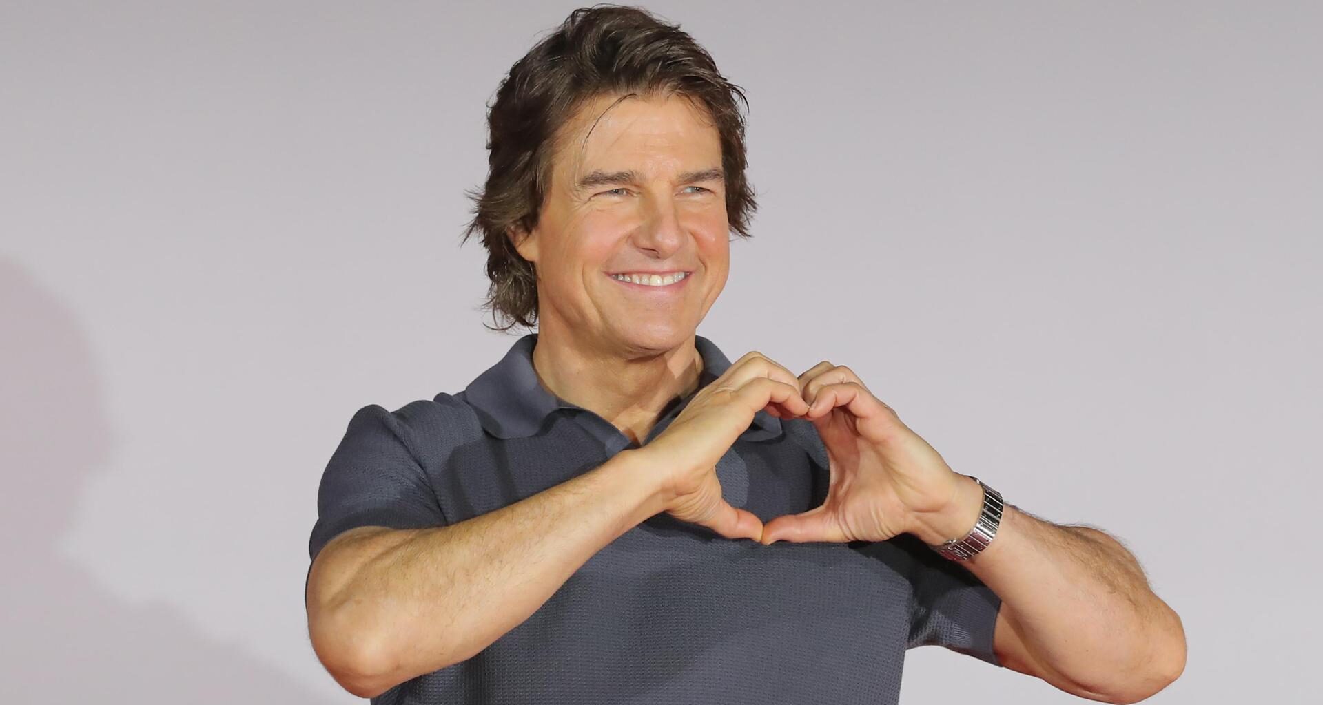 Tom Cruise poses at a press conference for the film