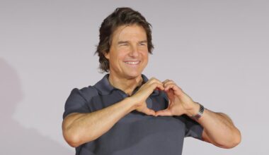 Tom Cruise poses at a press conference for the film
