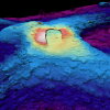 A three-dimensional map of the seabed shows the shape of the caldera of the Axial Seamount volcano. Warm colors show shallower depths and cool colors are deeper.