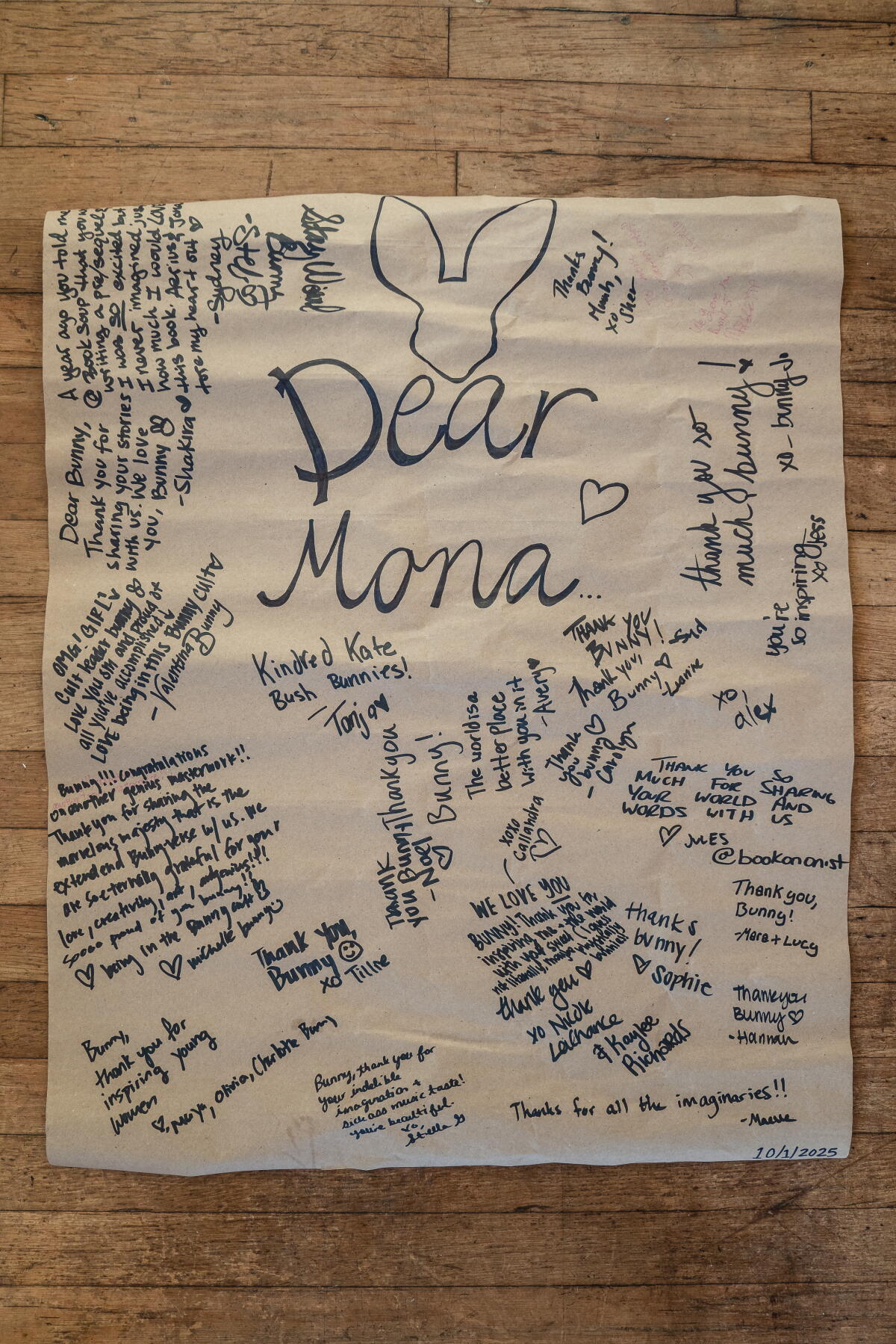A poster signed by fans at Mona Awad's book signing for "We Love You, Bunny" at the Center for Yoga in Los Angeles.