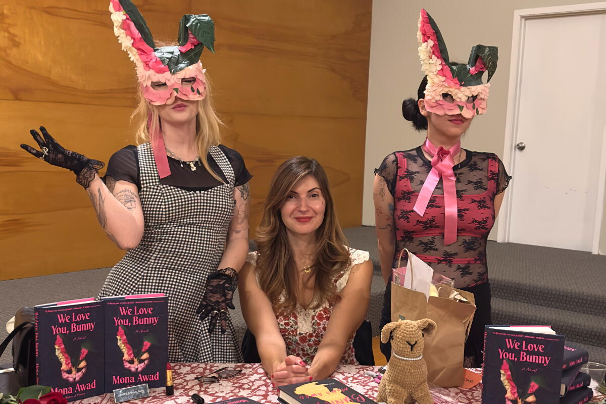 Valentina Bunny, left, and Michelle Bunny with author Mona Awad.