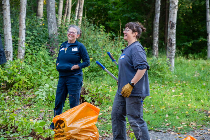 Emily Becker of the Anchorage Soil and Water Conservation District and event organizer Aurora Roth at a singles mixer/invasive plant pull in Tikishla Park in Anchorage's Airport Heights neighborhood on September 14, 2026.