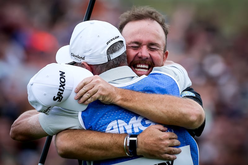 Shane Lowry celebrates with caddie Dermot Byrne on the 18th green. Photograph: Dan Clohessy/Inpho