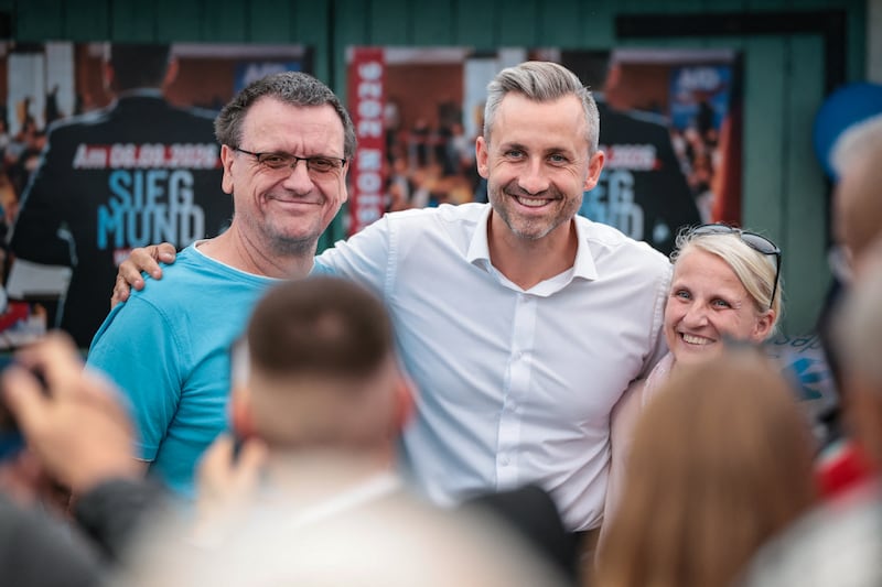 Ulrich Siegmund poses for photos with AfD supporters. Photograph: Ronny Hartmann/AFP via Getty Images