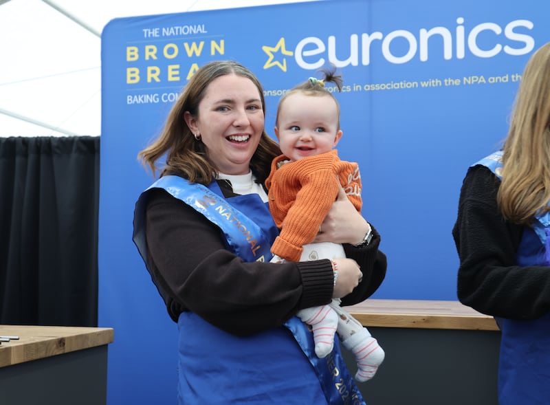 Olivia Nash from Dublin with her daughter Mabel after winning the final of the Brown Bread Baking Competition on the third day of the National Ploughing Championships in Tullamore, Co Offaly. Photograph: Alan Betson / The Irish Times