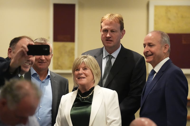 A party member takes a photograph with Ministers Niall Collins, Mary Butler and Jim O'Callaghan and Taoiseach Micheál Martin at Fianna Fáil's think-in at Tullamore Court Hotel in Tullamore, Co Offaly. Photograph: Niall Carson/PA Wire