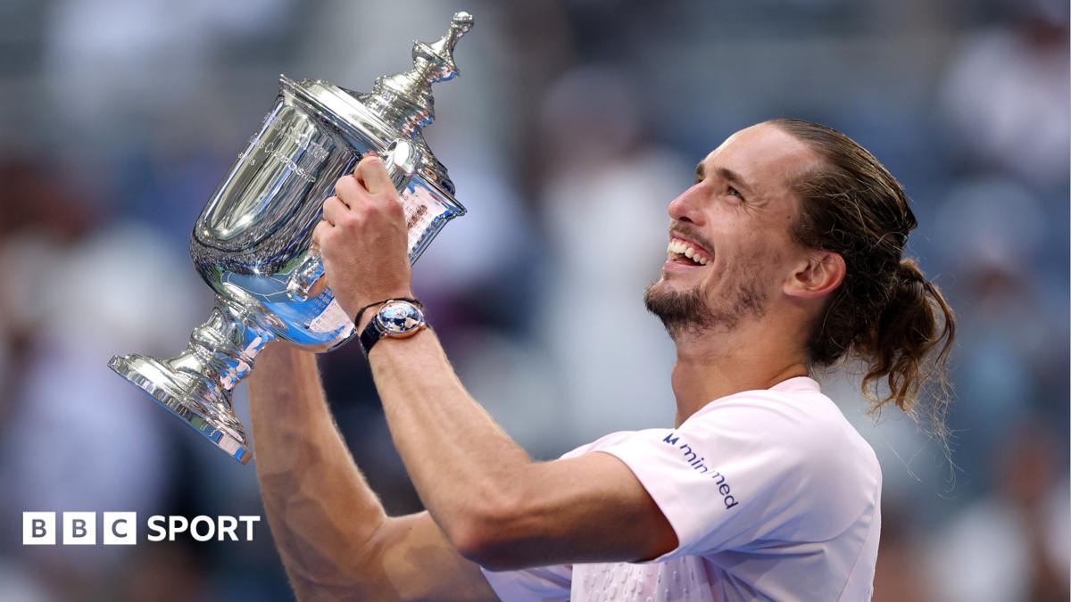 Alexander Zverev celebrates with the US Open trophy