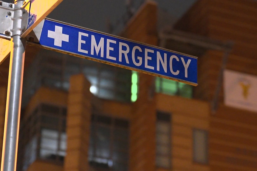 a sign in front of a hospital says emergency
