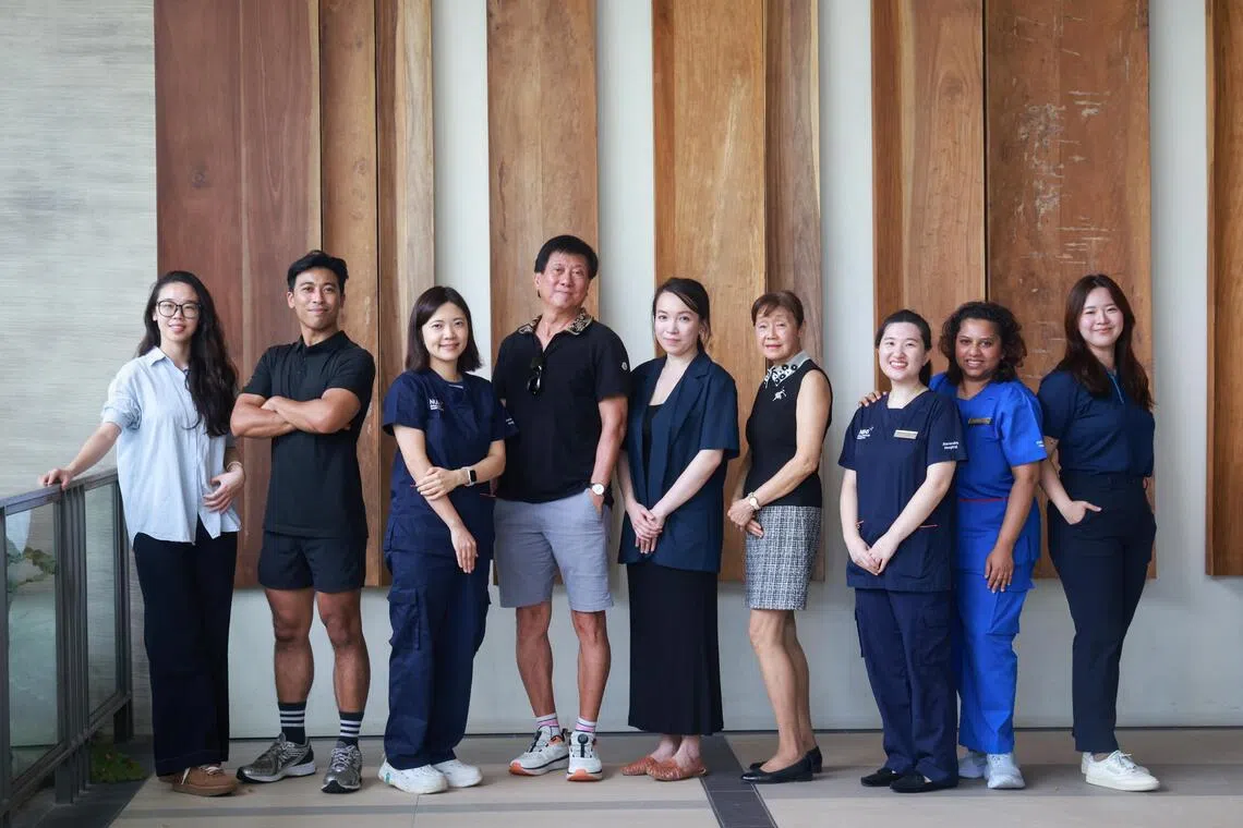 The team members at Alexandra Hospital’s Healthy Longevity Research Clinic (HLRC) with some participants (from left): research assistant He Qian; exercise physiologist Saiful Anwar; Michelle Liao, a doctor; participant Ivan Low; Laureen Wang, head of HLRC; participant Lee Siu Yin; Grace Chiang, a family medicine consultant with HLRC; senior staff nurse Eswari Sundrasagaran; and health coach Cheryl Tan.
