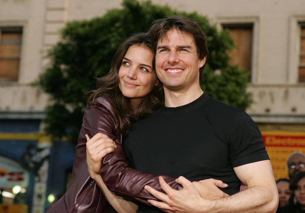 HOLLYWOOD - JUNE 27:  Actor Tom Cruise (R) and actress Katie Holmes arrive at the Los Angeles Fan Screening of "War of the Worlds" at the Grauman's Chinese Theatre on June 27, 2005 in Hollywood, California.  (Photo by Kevin Winter/Getty Images)