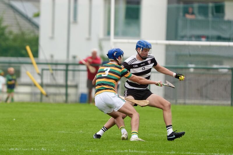 Glen Rovers' Conor Burke challenges Midleton's Charlie McCarthy for the ball. Picture: Noel Sweeney
