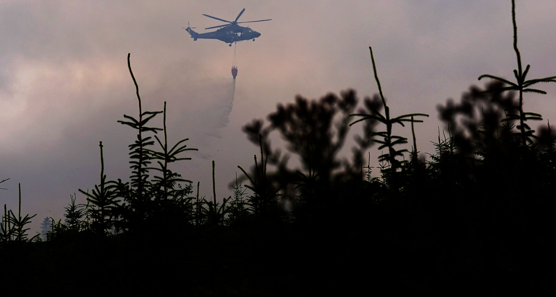 Members of the Irish Air Corps provide aerial support in tackling a major wildfire as it continues to burn at Slievenamon in Co Tipperary. Picture: PA