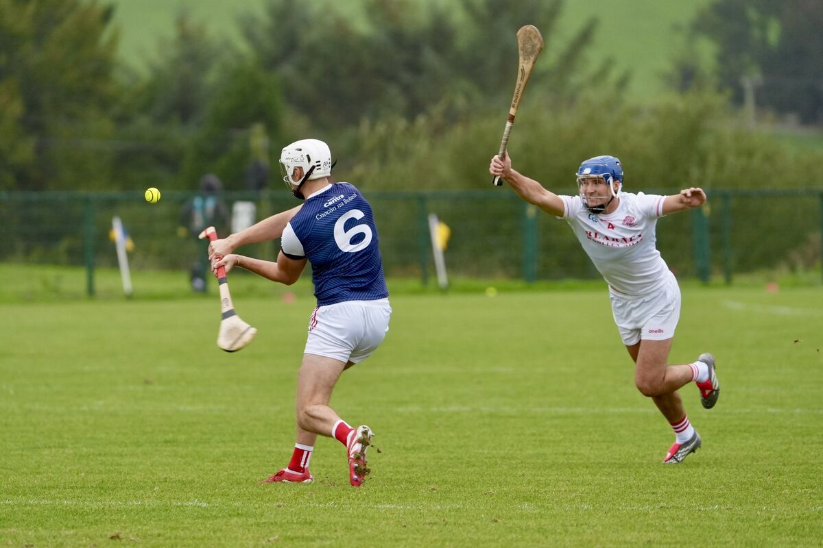  Watergrasshill’s Daire O’Leary shoots for a point as Blarney’s Stephen Mullane closes in. Picture: Noel Sweeney