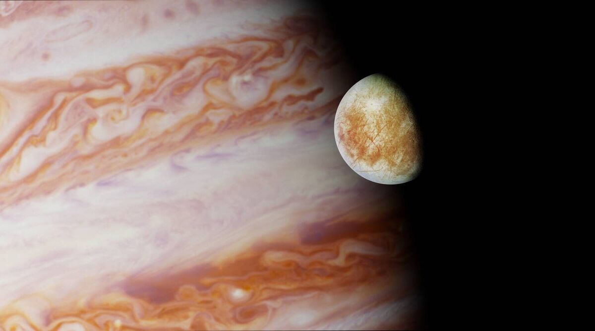 Jupiter and one of its orbiting moons Europa. The Galileo spacecraft discovered a potentially salty ocean beneath the surface of Europa, in the 1990’s.