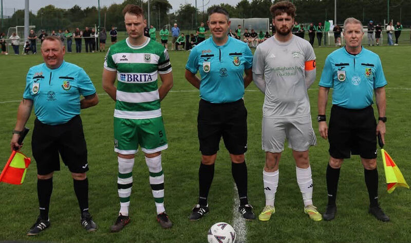 Adam Conroy is flanked by Trim Celtic's captain Tadgh Bradley and Coachford's Adam Murphy. Included are Paul Shelley and Josheph O'Hanlon. Picture: Barry Peelo.