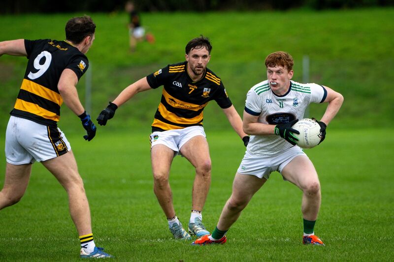 Buttevant’s Kevin Lenehan stands his ground against Ilen Rovers' Seán Connolly. Picture Chani Anderson