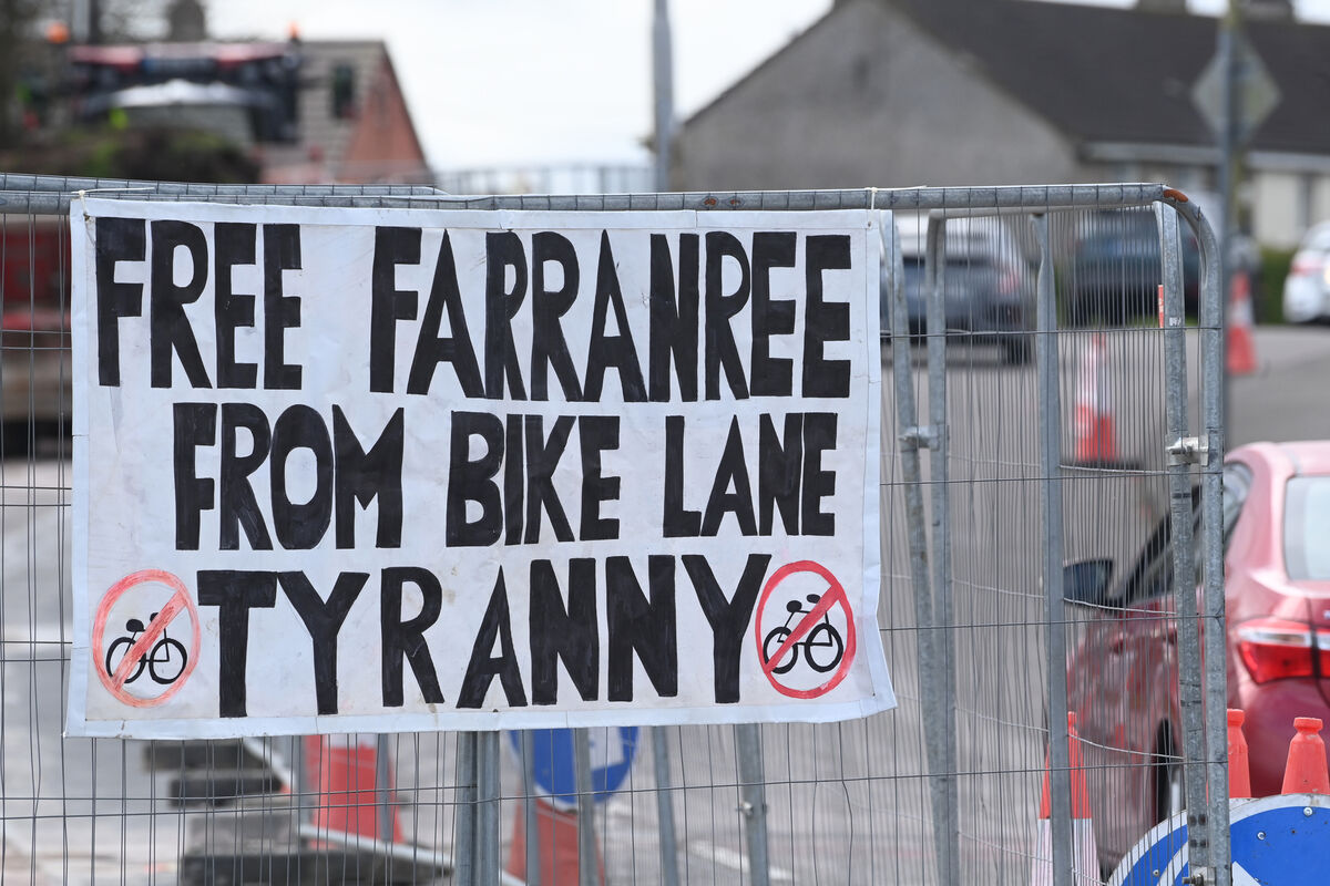  'Free Farranree from Bike Lane Tyranny' signage erected on the fencing at Knockpogue Avenue, Farranree as residents continue their campaign against the removal of tree and parking spaces to facilitate the construction of bike lanes in the northside community. Picture: Larry Cummins