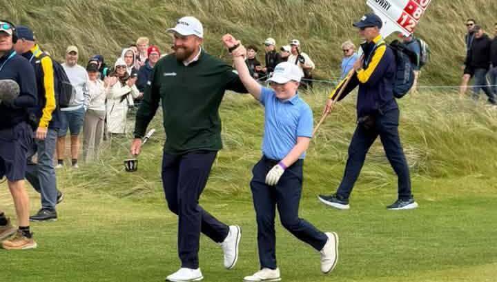 Athenry's Cillian Hirst with newly minted Amgen Irish Open champion Shane Lowry at Doonbeg.