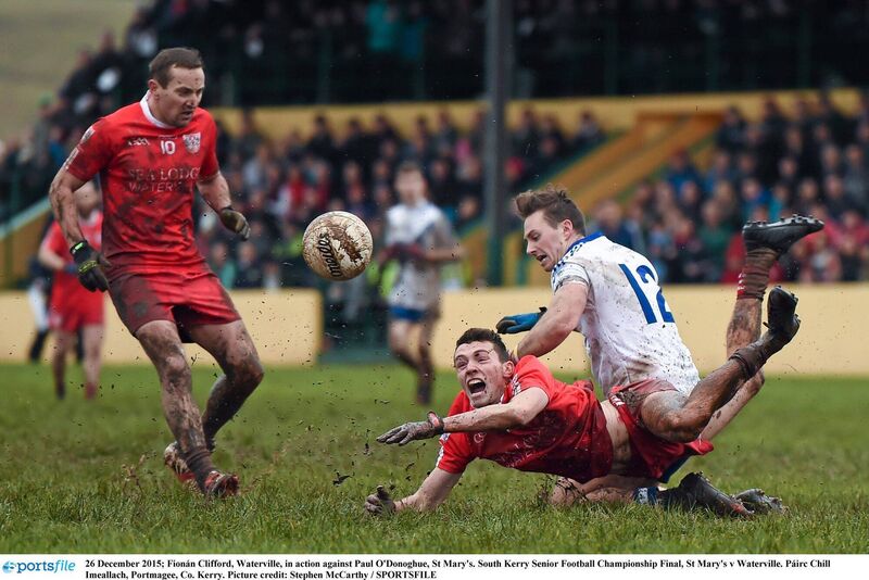 LOCAL PRIDE: St Stephen's Day 2015 and the battle for the Jack Murphy Cup (South Kerry SFC) between rivals St Mary's and Waterville. Here Fionán Clifford of Waterville gets the ball away under pressure from Paul O'Donoghue of St Mary's. Pic: Stephen McCarthy/Sportsfile 