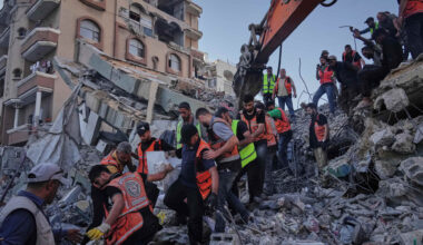 Palestinian civil defence crews carrying a body from the rubble of a collapsed building in Gaza last Wednesday. It had housed displaced Palestinians but was damaged by recent Israeli missile attacks. Picture: Jehad Alshrafi/AP