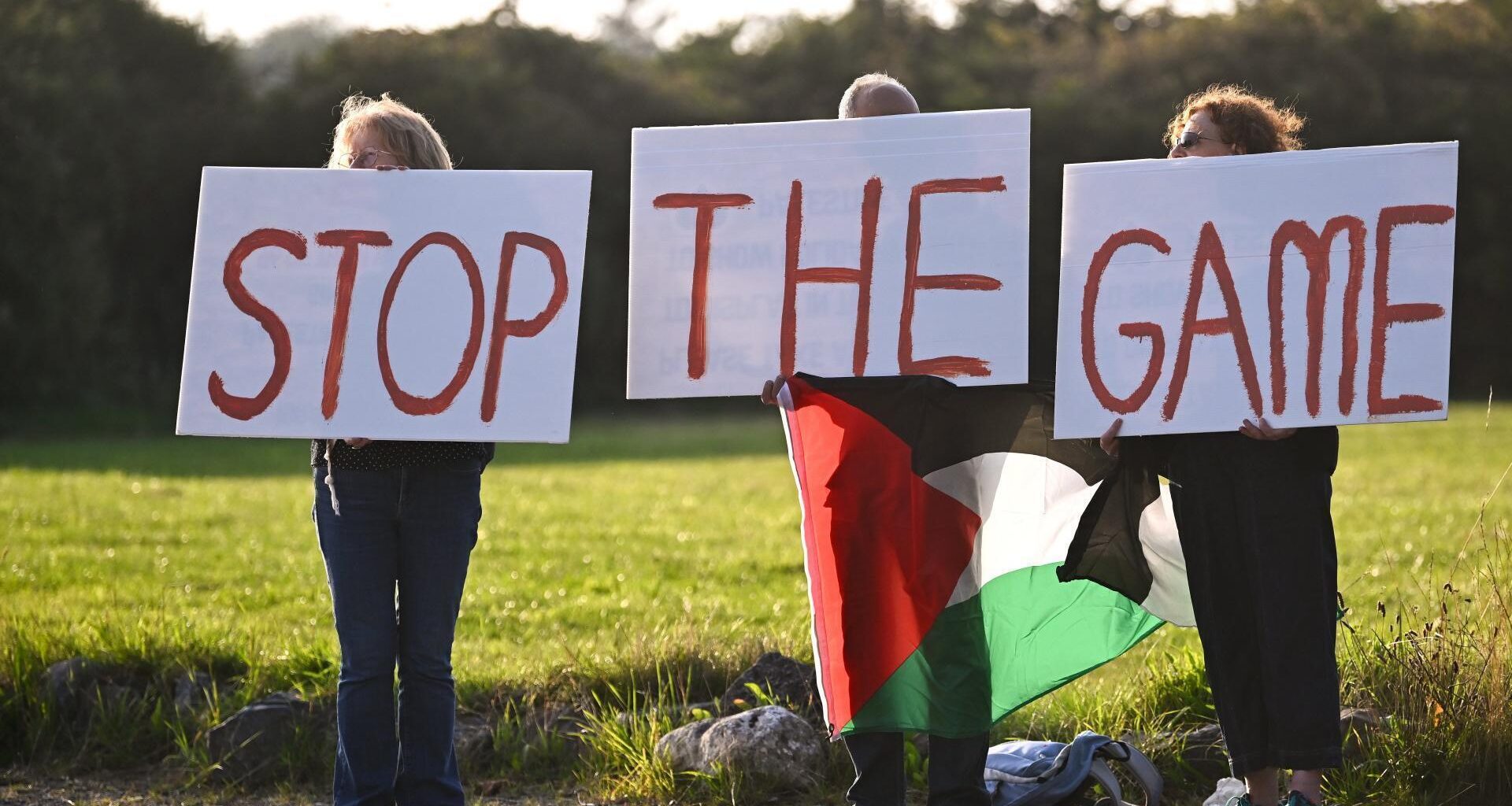 STOP THE GAME protesters outside the ground, calling for Republic of Ireland's upcoming matches against Israel to be stopped, before the SSE Airtricity Men’s Premier Division match between Galway United and Shelbourne at Eamonn Deacy Park in Galway. Photo by Piaras Ó Mídheach/Sportsfile