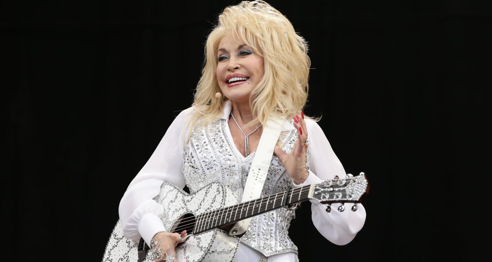 Dolly Parton performing on the Pyramid Stage at the Glastonbury Festival, at Worthy Farm in Somerset.