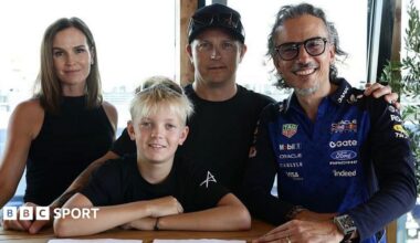 Minttu Raikkonen, Robin Raikkonen, Kimi Raikkonen and Laurent Mekies pose for a photo after Robin signs for the Red Bull junior team in September 2026